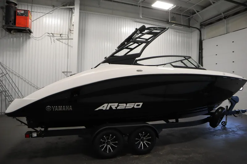 Slide: The Image of 2026 Yamaha AR250 boat in a garage, sleek black and white design. - 3