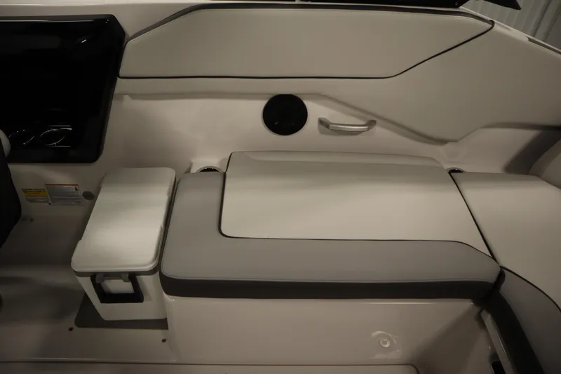 Slide: The Image of 2026 Yamaha Boats AR250 interior seating with storage compartment and sleek design. - 36