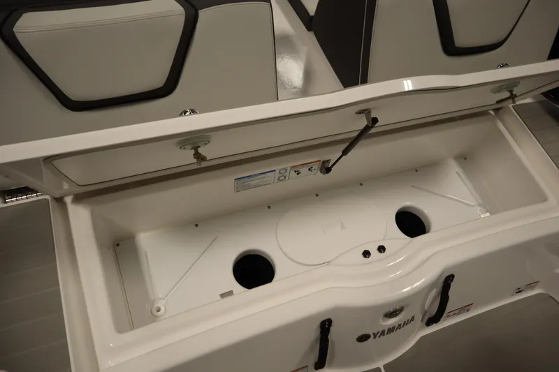Slide: The Image of Open storage compartment of 2026 Yamaha Boats AR250, showcasing interior design and functionality. - 41