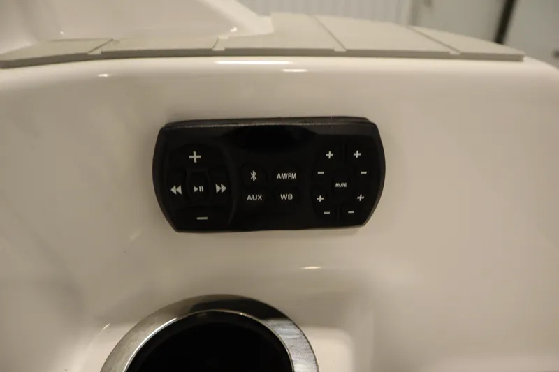 Slide: The Image of Control panel on 2026 Yamaha Boats AR250, featuring audio and media buttons. - 42