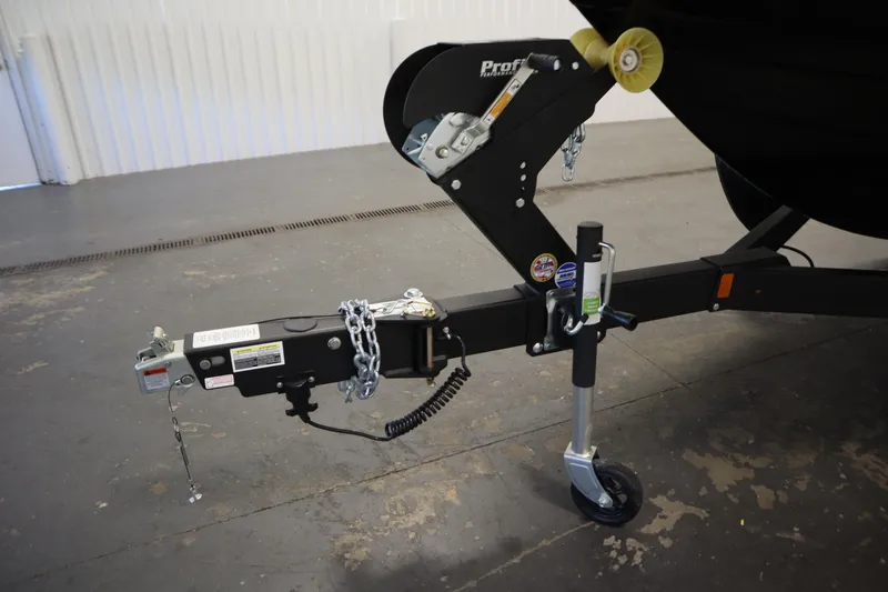 Slide: The Image of Trailer hitch of 2026 Yamaha Boats AR250, featuring secure chains and wheel jack. - 44