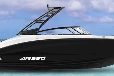 Slide: The Image of 2026 Yamaha Boats AR250 on clear water with sleek black and white design. - 46