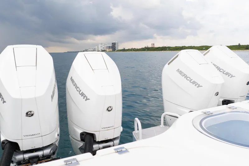 Slide: The Image of Four Mercury outboard engines on a 2022 Invincible 46 Catamaran, ocean view. - 18