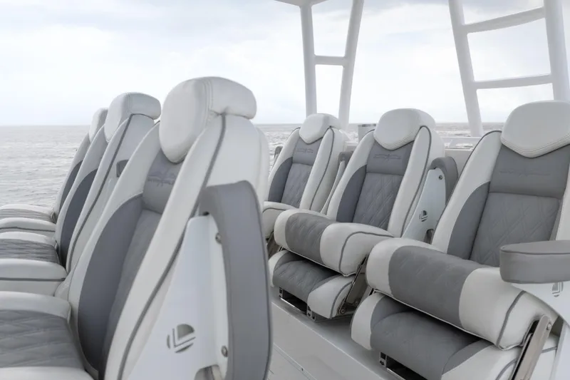 Slide: The Image of Luxurious seating on 2022 Invincible 46 Catamaran, featuring plush gray and white upholstery. - 22