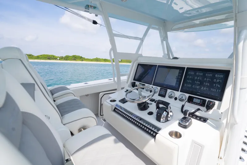Slide: The Image of Luxurious helm of 2022 Invincible 46 Catamaran with advanced navigation displays. - 25