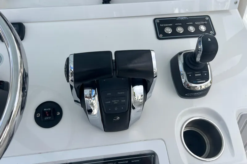 Slide: The Image of Control panel of 2022 Invincible 46 Catamaran with throttle and joystick controls. - 31