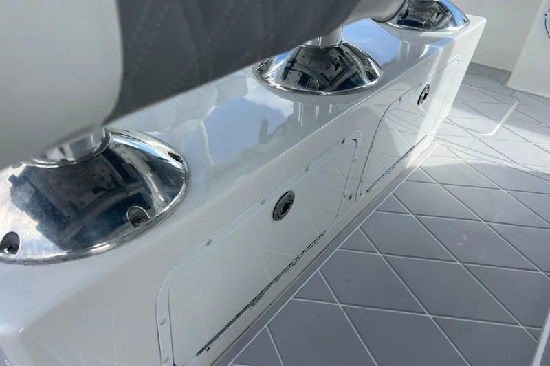 Slide: The Image of Interior view of 2022 Invincible 46 Catamaran with sleek seating and storage compartments. - 36