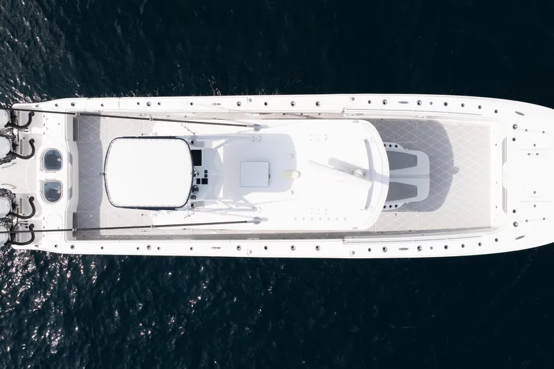 Slide: The Image of Overhead view of 2022 Invincible 46 Catamaran on open water. - 4