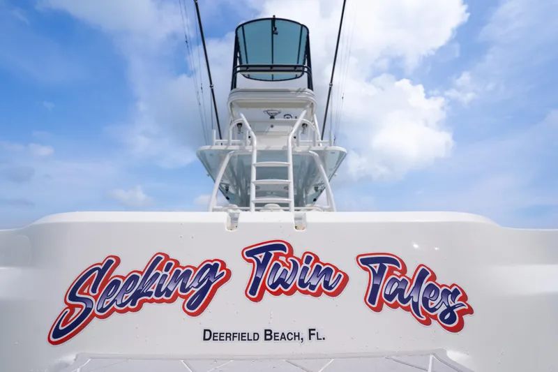 Slide: The Image of Invincible 46 Catamaran 2022, "Seeking Twin Tales," Deerfield Beach, FL, under blue sky. - 43