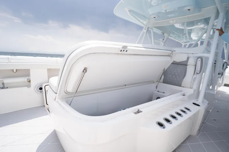 Slide: The Image of 2022 Invincible 46 Catamaran with open storage compartment on deck. - 48