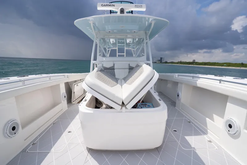 Slide: The Image of 2022 Invincible 46 Catamaran on open water, featuring spacious deck and modern design. - 50