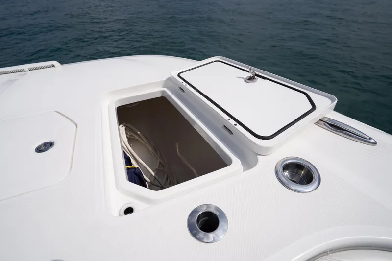 Slide: The Image of Open storage compartment on 2022 Invincible 46 Catamaran deck, near ocean. - 51