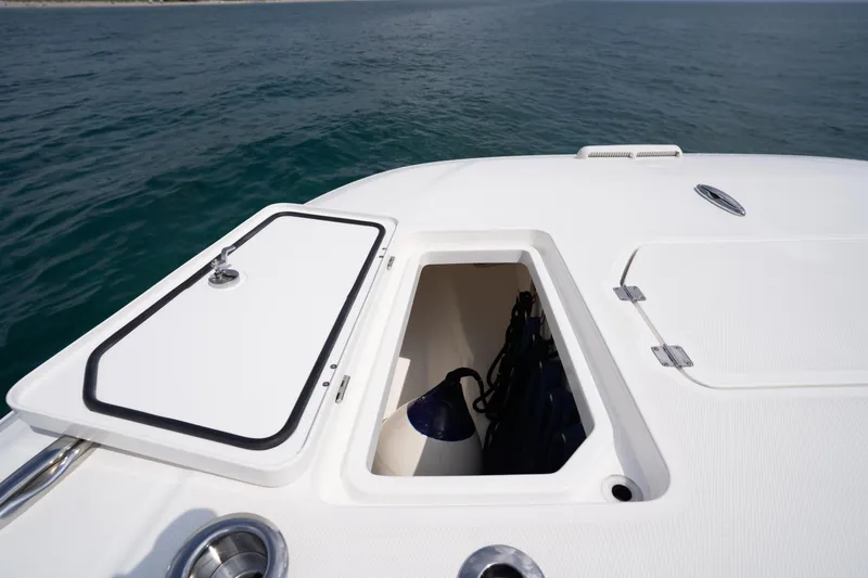 Slide: The Image of Open storage compartment on 2022 Invincible 46 Catamaran, with ocean backdrop. - 52