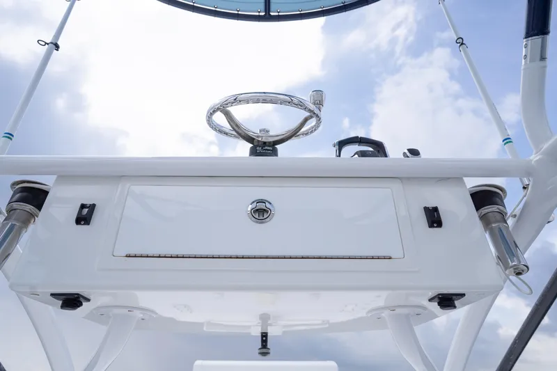 Slide: The Image of Helm of 2022 Invincible 46 Catamaran against a cloudy sky backdrop. - 57