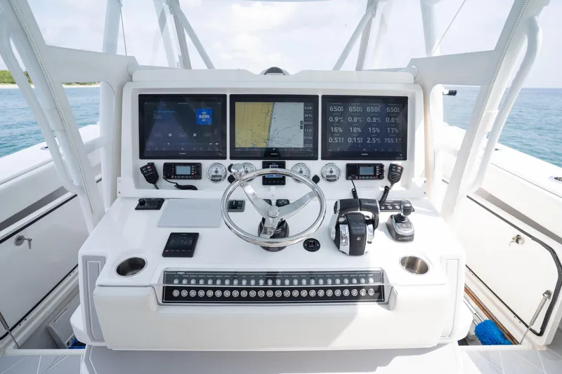 Slide: The Image of Control panel of 2022 Invincible 46 Catamaran with advanced navigation and communication systems. - 60