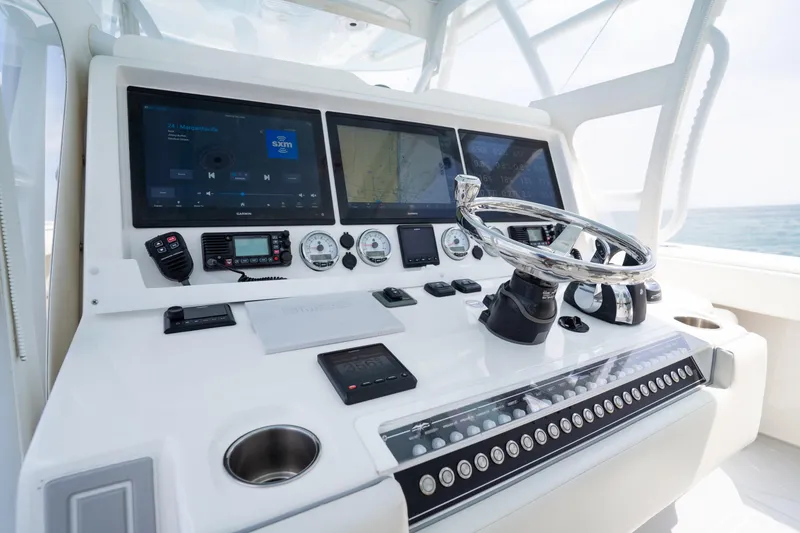 Slide: The Image of Helm of 2022 Invincible 46 Catamaran with advanced navigation and control systems. - 62