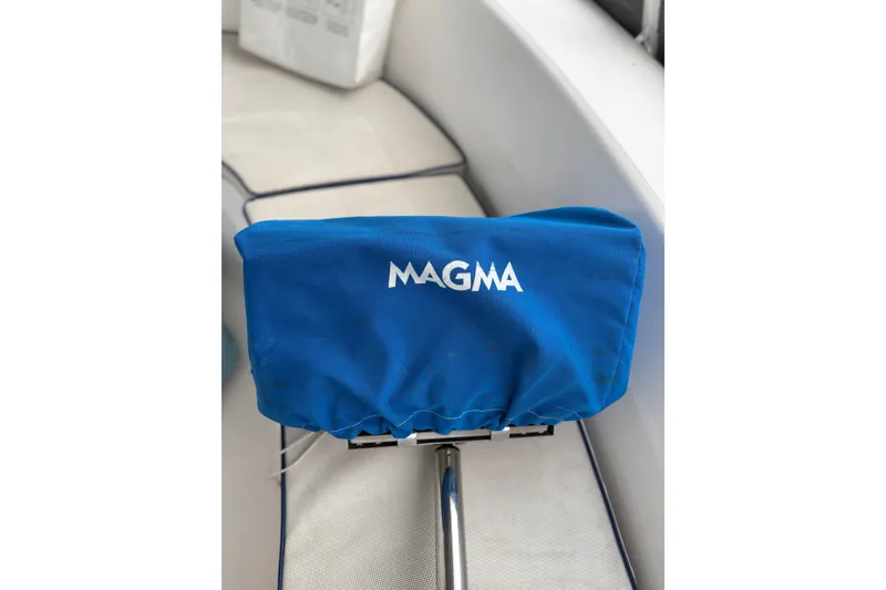 Slide: The Image of Blue Magma grill cover on a 2002 Hunter 386 sailboat deck. - 12