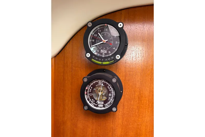 Slide: The Image of Gauges on a 2002 Hunter 386 sailboat's wooden panel. - 17