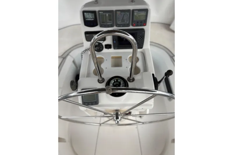Slide: The Image of Steering console of a 2002 Hunter 386 sailboat with navigation instruments. - 3