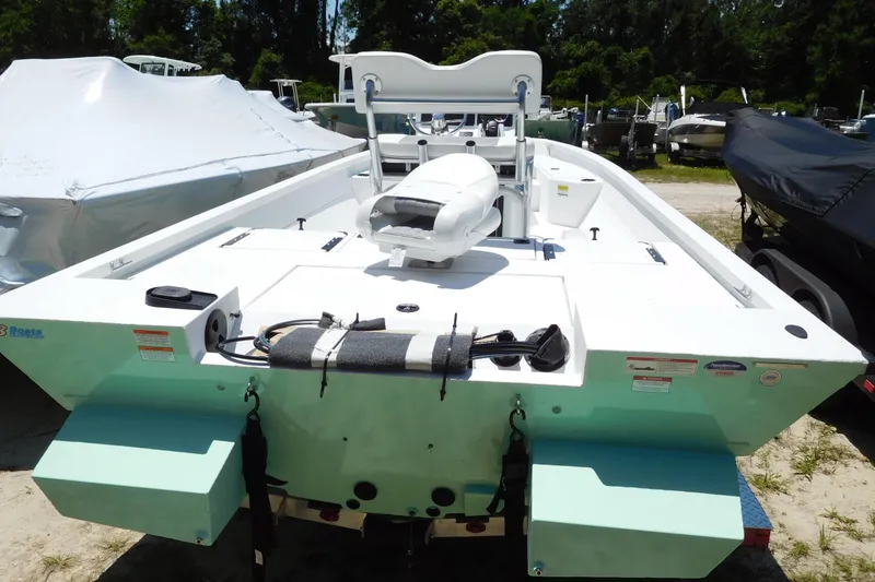 The Image of 2025 G3 Bay 21 GX boat, rear view, in a sunny outdoor setting. - 1