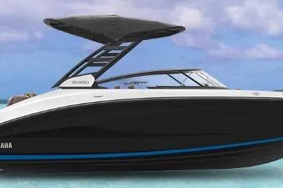 Slide: The Image of 2026 Yamaha Boats 252SD in a garage, front view, sleek design. - 1