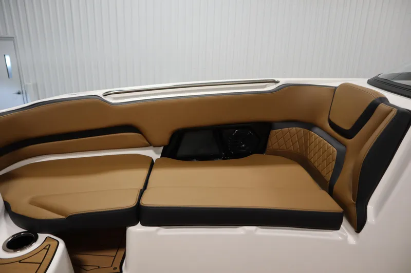 Slide: The Image of 2026 Yamaha Boats 252SD interior with tan and black cushioned seating. - 14