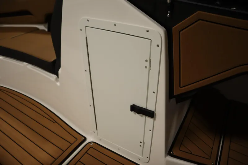 Slide: The Image of 2026 Yamaha Boats 252SD interior with sleek white panel and wood accents. - 15