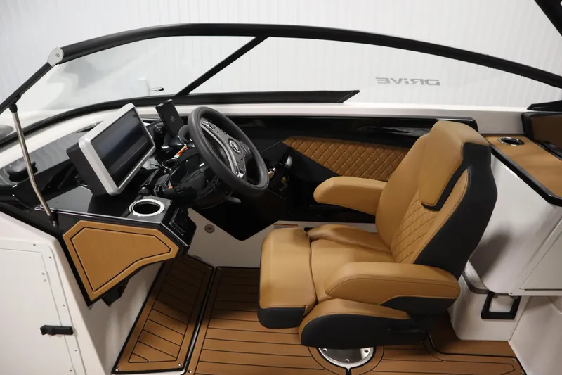 Slide: The Image of 2026 Yamaha Boats 252SD cockpit with luxurious tan seating and modern dashboard controls. - 17