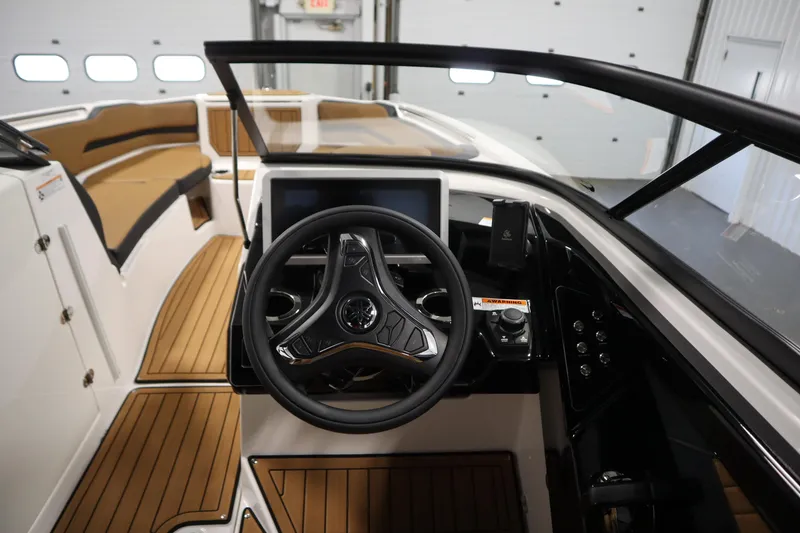 Slide: The Image of 2026 Yamaha Boats 252SD cockpit with modern steering and dashboard controls. - 18