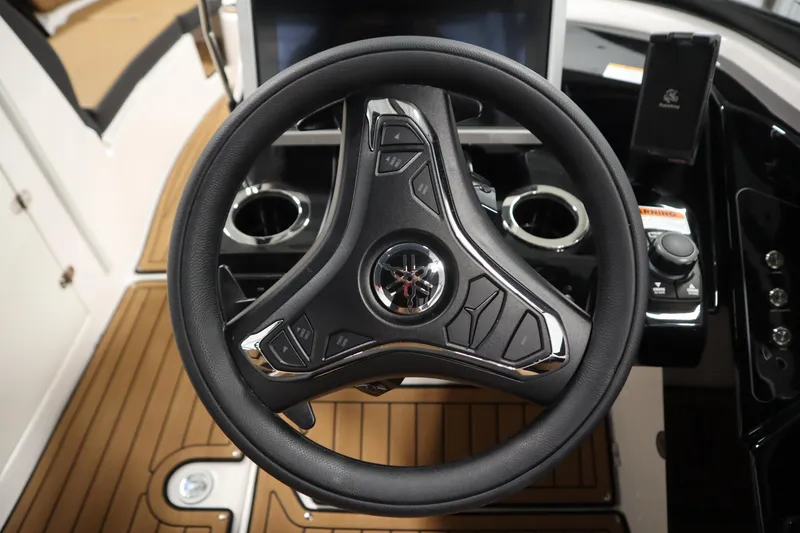 Slide: The Image of Steering wheel of 2026 Yamaha Boats 252SD, featuring modern controls and sleek design. - 19