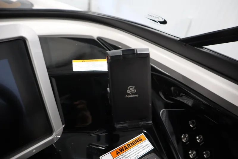 Slide: The Image of Dashboard of 2026 Yamaha Boats 252SD featuring AquaAmp device holder. - 21