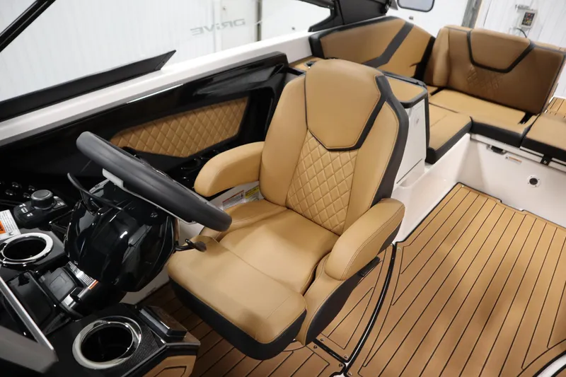 Slide: The Image of 2026 Yamaha Boats 252SD interior with tan leather seating and modern steering console. - 25