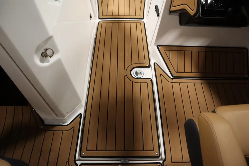 Slide: The Image of 2026 Yamaha Boats 252SD interior with sleek, wood-patterned flooring and modern design elements. - 27