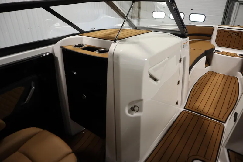 Slide: The Image of 2026 Yamaha Boats 252SD interior with sleek design and wood accents. - 29
