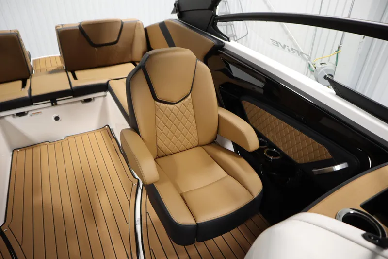 Slide: The Image of Luxurious interior of 2026 Yamaha Boats 252SD with tan leather seating and sleek design. - 31