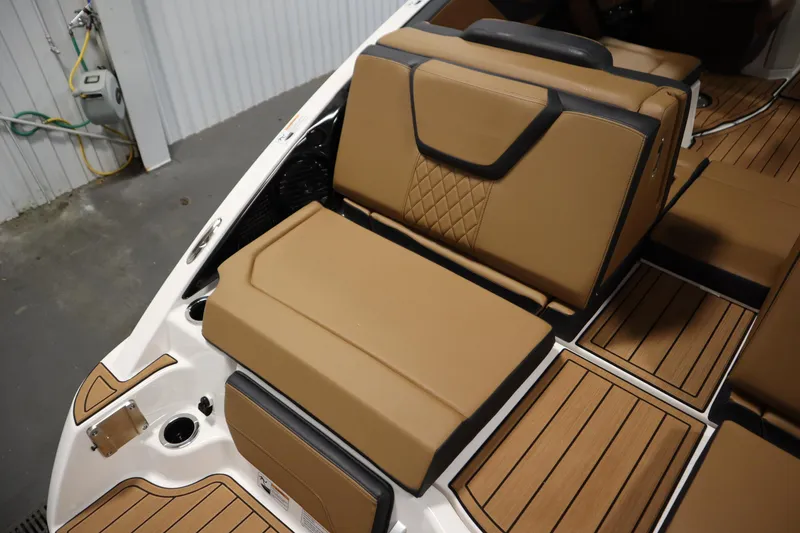 Slide: The Image of 2026 Yamaha Boats 252SD interior with tan leather seating and wood-style flooring. - 39