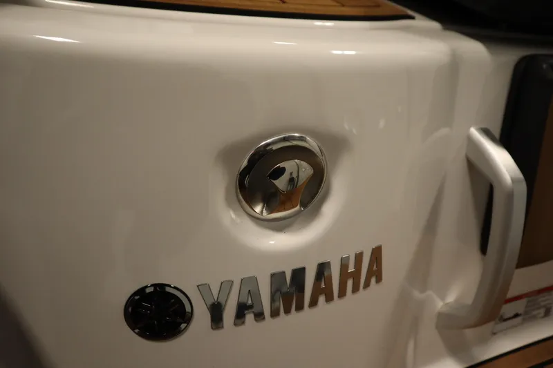 Slide: The Image of 2026 Yamaha Boats 252SD logo and handle on sleek white surface. - 41