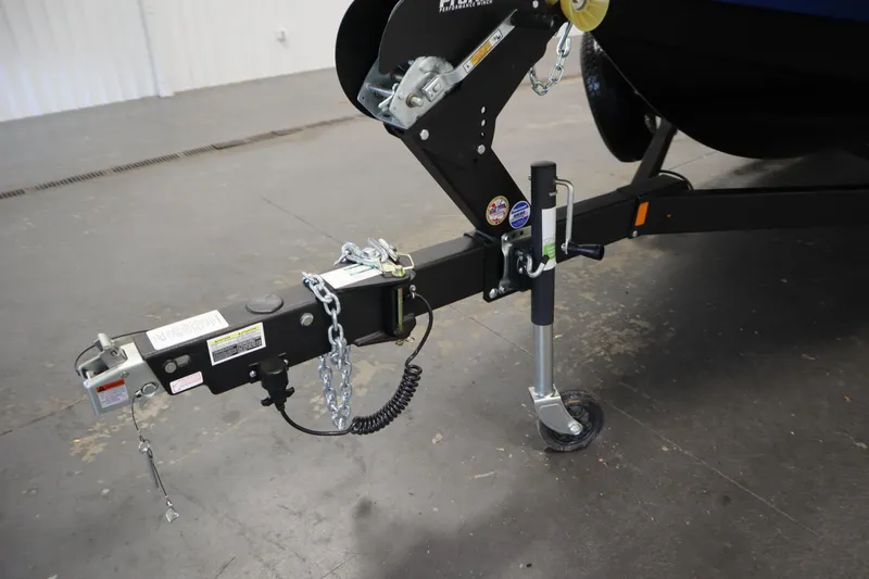 Slide: The Image of Trailer hitch of 2026 Yamaha Boats 252SD, featuring safety chains and wheel jack. - 44