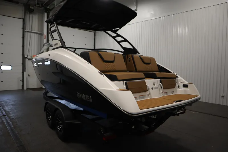 Slide: The Image of 2026 Yamaha Boats 252SD in a showroom, showcasing sleek design and luxurious seating. - 6