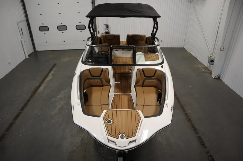 Slide: The Image of 2026 Yamaha Boats 252SD, luxury interior, spacious seating, sleek design, indoor showroom display. - 8