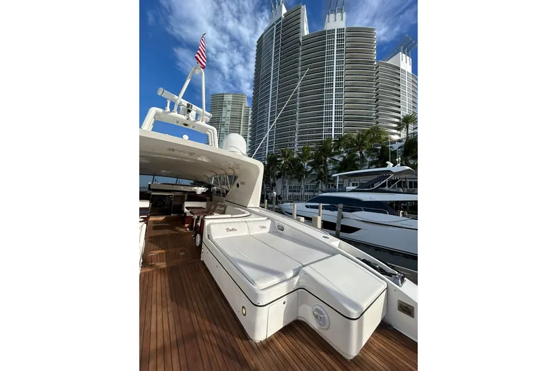 Slide: The Image of Luxurious 1999 Mangusta 80 yacht docked, featuring spacious deck and elegant design. - 19