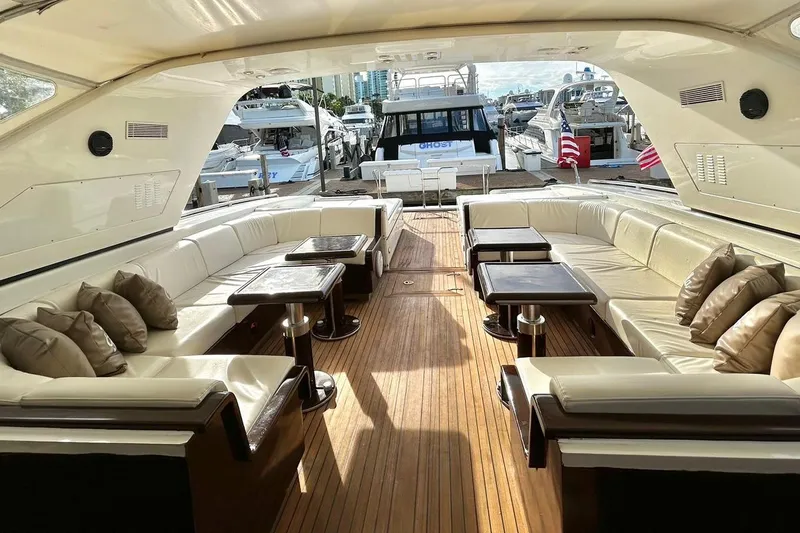 Slide: The Image of 1999 Mangusta 80 yacht with "Bella Vita" cushions, white seating area. - 21