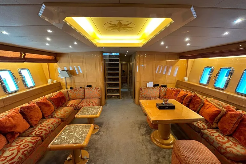 Slide: The Image of 1999 Mangusta 80 yacht interior with polished wood and modern design elements. - 31