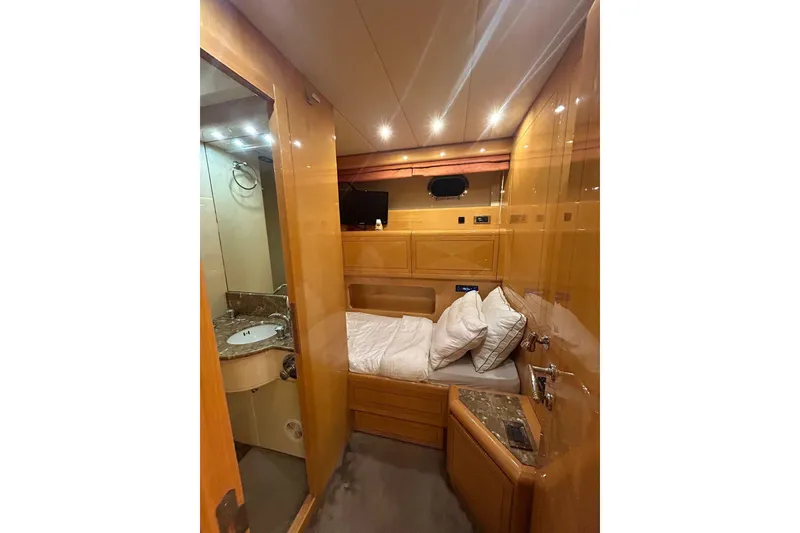 Slide: The Image of Luxurious interior of a 1999 Mangusta 80 yacht with elegant wood finishes. - 33