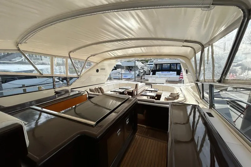 Slide: The Image of Luxurious 1999 Mangusta 80 yacht interior with elegant seating and polished wood finishes. - 48