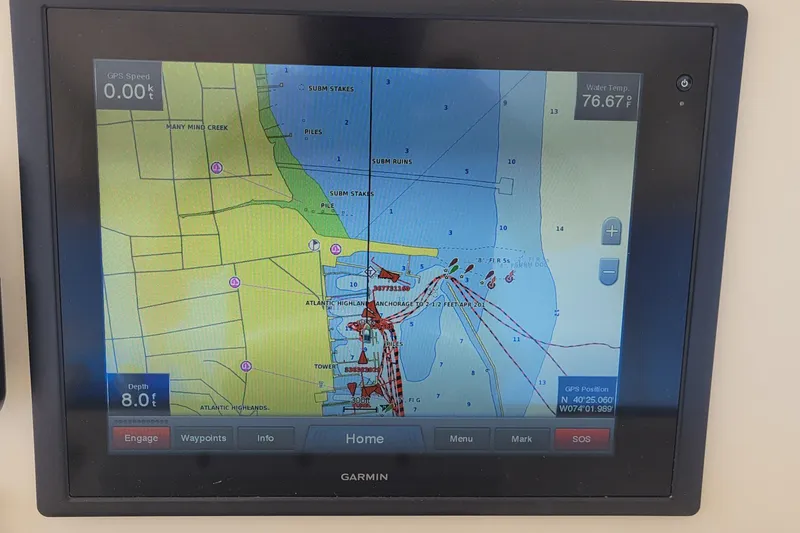 Slide: The Image of Garmin GPS display on 1992 Luhrs 380 Open, showing nautical map and navigation data. - 10