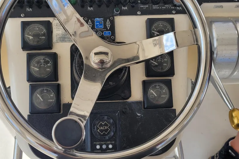 Slide: The Image of Steering wheel and gauges of a 1992 Luhrs 380 Open boat cockpit. - 12