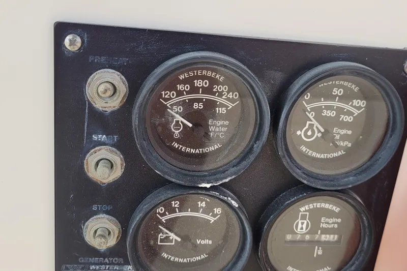 Slide: The Image of Control panel of a 1992 Luhrs 380 Open boat with Westerbeke gauges. - 14