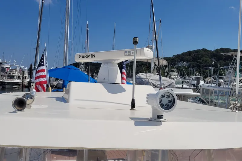 Slide: The Image of 1992 Luhrs 380 Open boat with Garmin radar, docked in a marina. - 20