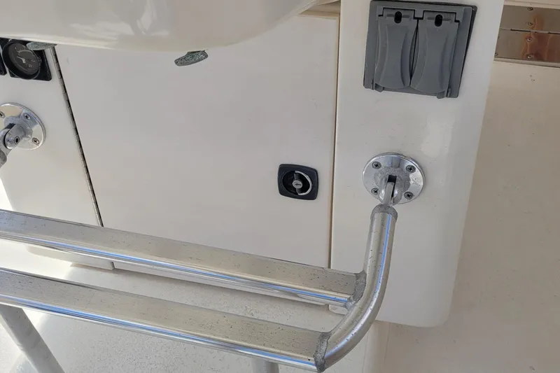 Slide: The Image of Control panel and railing on a 1992 Luhrs 380 Open boat. - 23
